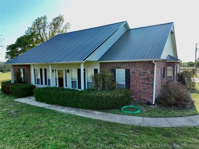 Front of home with sidewalk leading to driveway