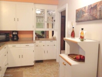 Kitchen updated with new countertops and flooring.