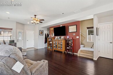 Living area featuring stairs, recessed lighting, c