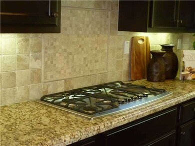 GE Mongram 5 burner gas cooktop, full height splas