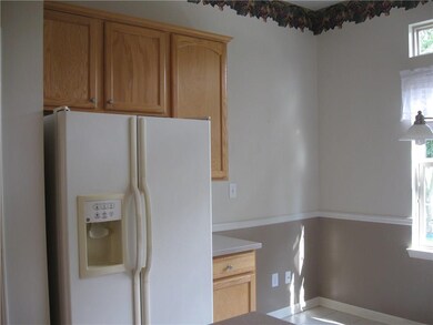 Kitche with part of breakfast nook showing.