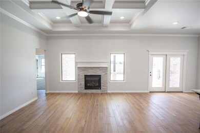 Unfurnished living room featuring light hardwood /