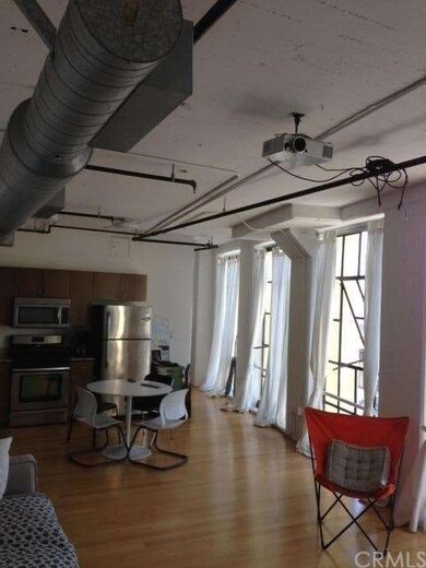 View of Living Room and Kitchen from Entry