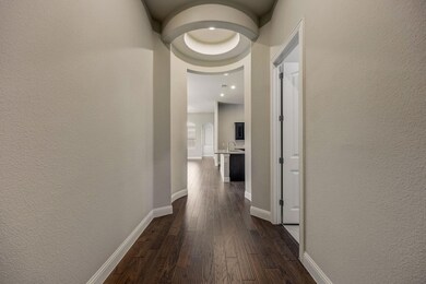 Corridor featuring dark hardwood / wood-style floo