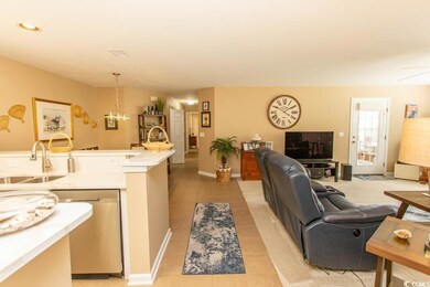Living room featuring light tile patterned floors 