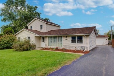 Front of home with gate open