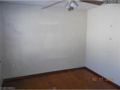bedroom 2 with hardwood floors