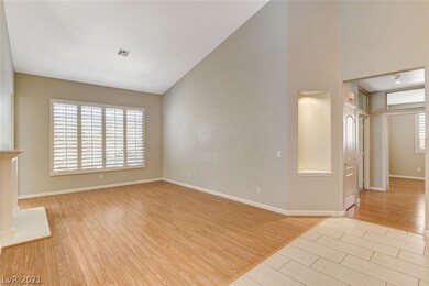 Living room has plantation shutters