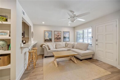 Living room, with view of the pool through the win