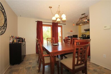 The formal dining room is open to the kitchen crea