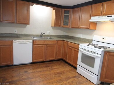 Applianced kitchen with gas range, oven and dishwa