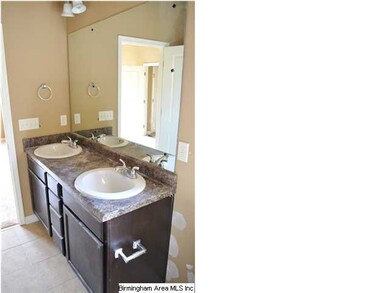 Master bath features high vanity with double sinks