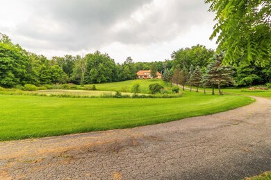 9+ Acres w/ Pond