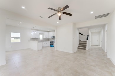 Spacious and bright living area with modern tile f