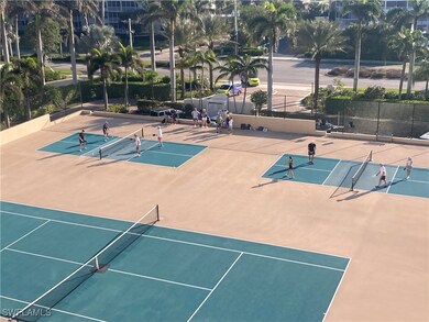 View of tennis court featuring basketball court