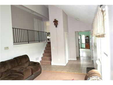 Living Room. To kitchen and 2nd floor.
