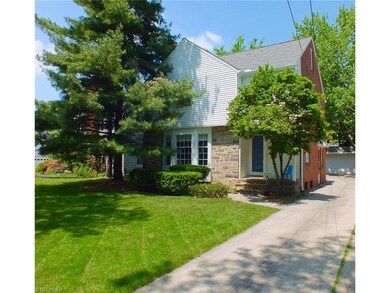This charming Shaker Heights home with pretty land