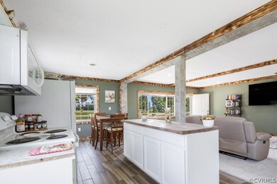 Kitchen featuring white appliances, dark wood-type