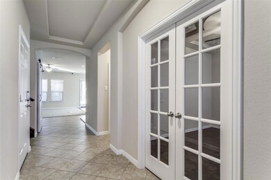 Enjoy a book in the elegant study with French door