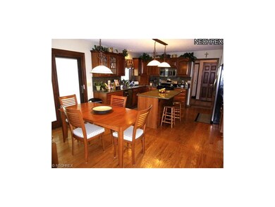 Updated Kitchen with hardwood flooring, granite to