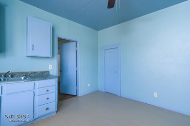 Kitchen with ceiling fan, sink, light hardwood / w