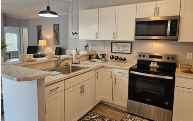 Kitchen features all new cabinetry and countertop