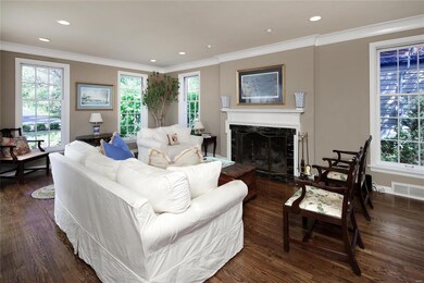 Light filled living room with fireplace