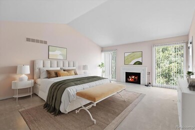 Bedroom with multiple windows, and a gas fireplace, and lofted ceiling