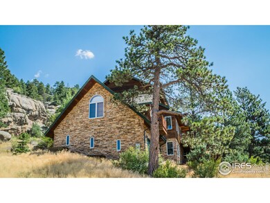 Mountain home of stone and log