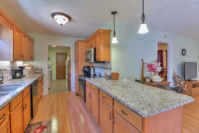 The Kitchen has a Bar, Granite Counter Tops and a Pantry. All newly installed in 2014