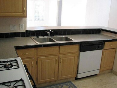 Kitchen Gas Range and Travertine Floor