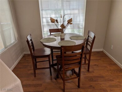 Dining room with baseboards and wood finished floo