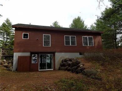 Rear view of home which has view of...