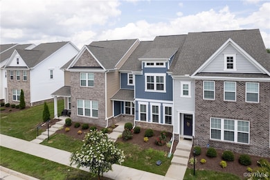 View of front of house with a front yard, stone si