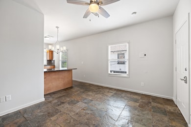 The living area is open to the kitchen via a break