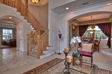 Entry way with view of living room, formal dining 