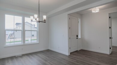 Unfurnished dining area with a chandelier and dark wood-type flooring