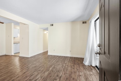 Unfurnished room with hardwood / wood-style floori