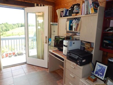 Sun room office with atrium door to...