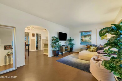 Living Room w/ Archway to Kitchen