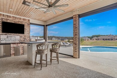 Outdoor living area has 2 tvs.