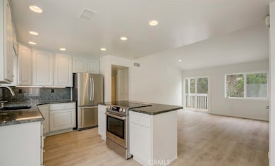 Light, bright, coastal modern vibes - BRAND NEW LVP flooring just installed + baseboards + fresh interior paint