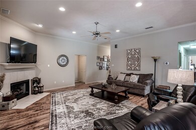Family Room, showing fireplace (gas logs convey) and TV on mantle.