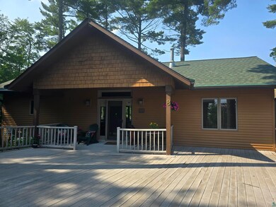 Back of property with a deck