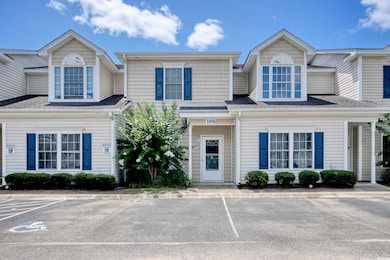 Townhome / multi-family property with uncovered parking