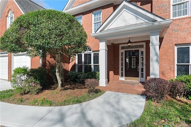 Three-side brick with a covered entry, this home f