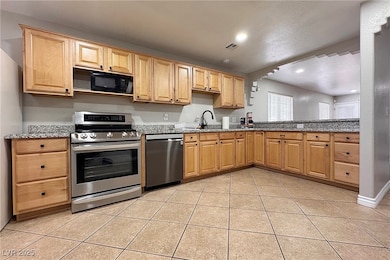 Kitchen with appliances with stainless steel finis