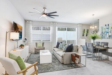 Open Floor Plan with Sliders Out to Backyard for Additional Entertaining Space! (photo of model home)