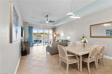 Tiled dining room with a raised ceiling, ornamenta