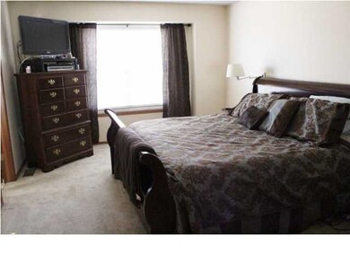 Master bedroom with walk in closet and master bath